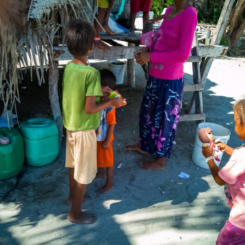 children of sea gypsies in their village in an island