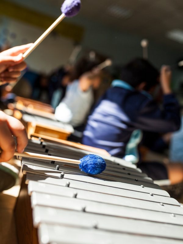 girl playing xylophone